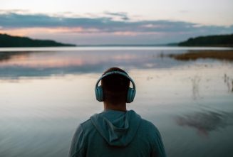 man-meditates-with-headphones-nature-he-listens-pleasant-calm-music-before_283470-4146